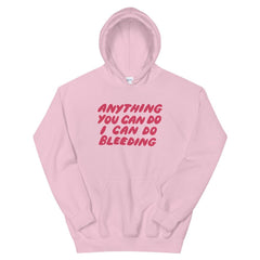 Pink feminist hoodie that says Anything You Can Do I Can Do Bleeding in red bubble writing - Shop Women’s Rights apparel and dump him shirts
