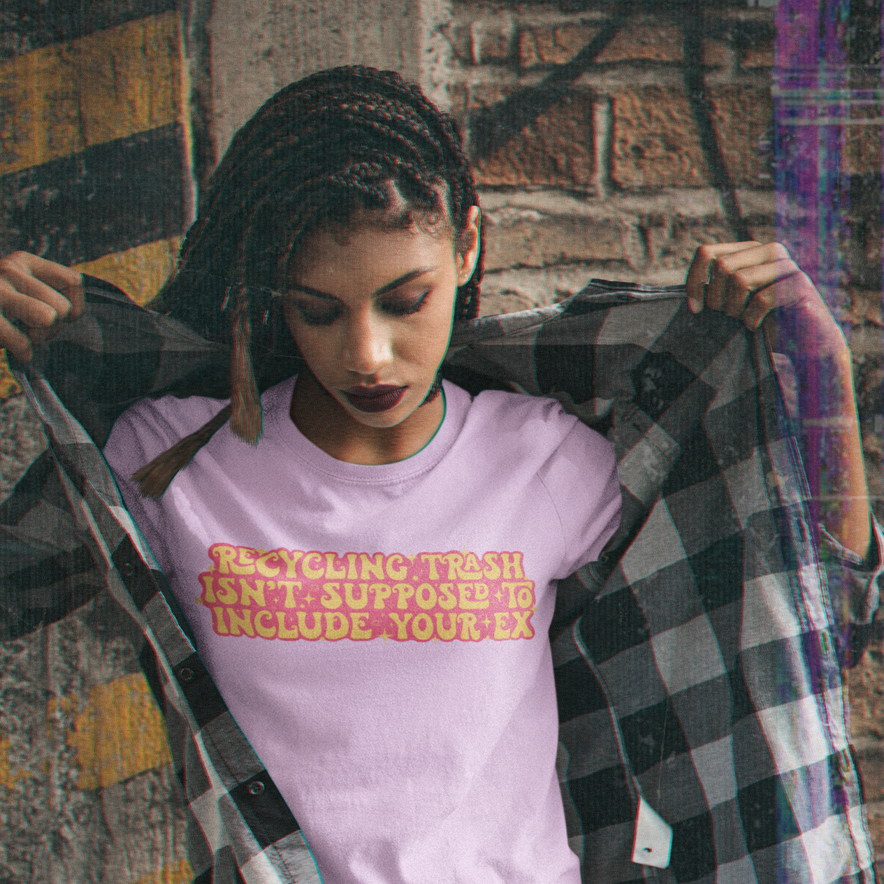 Feminist shirt that says Recycling Trash Isn’t Supposed To Include Your Ex in yellow and pink writing. Shop Women’s Rights T-shirts and Feminist Clothing