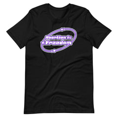Black feminist tshirt that says abortion is freedom in a purple and white y2k circular graphic. Shop Feminist Trash for pro choice tshirts and political clothes