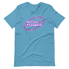 ocean blue coloured feminist tshirt that says abortion is freedom in a purple and white y2k circular graphic. Shop Feminist Trash for pro choice tshirts and political clothes