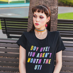 funny feminist tee that says Boy Bye You Aren't Worth The UTI in yellow, blue, pink, white and purple writing- shop Feminist Trash Store for funny t-shirts for women and dump him shirts