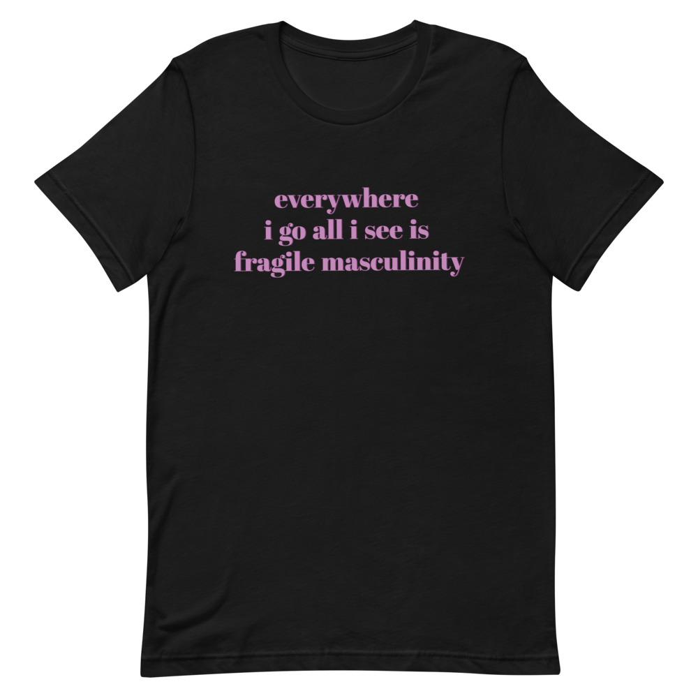 black feminist tee that says Everywhere I Go All I See Is Fragile Masculinity in purple lowercase font. Shop Feminist Trash for feminist tshirts, political clothing, ACAB shirts, Witchy outfits and dump him shirts