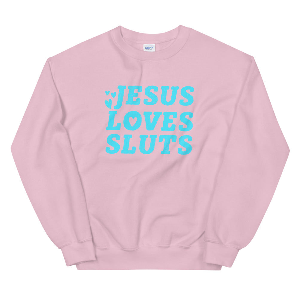pink feminist sweatshirt that says Jesus Loves Sluts in bold blue handletterd writing- shop feminist trash store for feminist t shirts, political clothing and dump him shirts