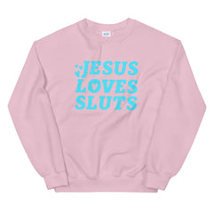 pink feminist sweatshirt that says Jesus Loves Sluts in bold blue handletterd writing- shop feminist trash store for feminist t shirts, political clothing and dump him shirts