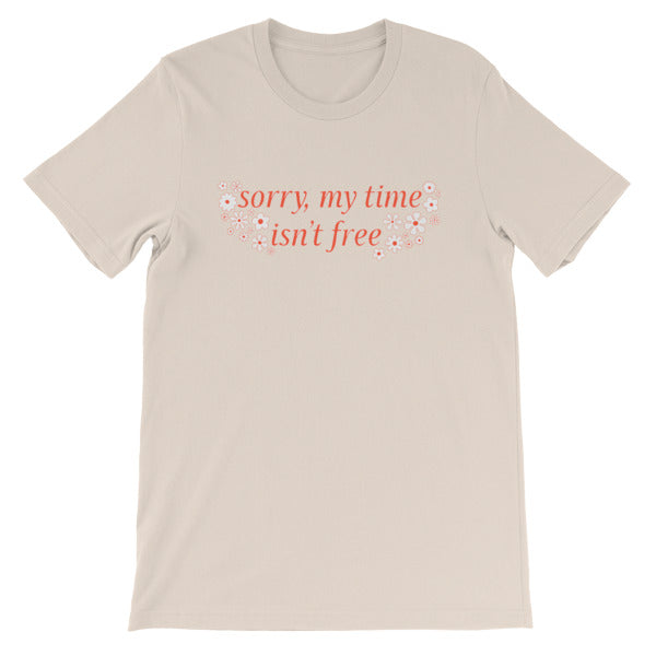 soft cream feminist tee that says sorry my time isn't free in orange writing surrounded by white flowers- shop feminist t-shirts, dump him shirts and political clothing