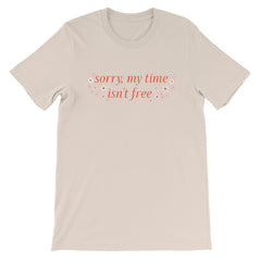 soft cream feminist tee that says sorry my time isn't free in orange writing surrounded by white flowers- shop feminist t-shirts, dump him shirts and political clothing