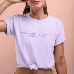 purple feminist tee that says Sports? I Don’t Know Her her in purple retro glitch writing- shop feminist trash for political clothing, feminist tees and dump him shirts