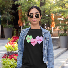 black feminist tshirt that says Why Can’t You Find The Clit? in three candy hearts- shop feminist apparel and dump him shirts