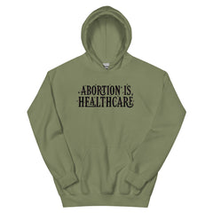 Army green feminist hoodie that says abortion is healthcare in black and pink hand lettered text- shop social justice apparel 