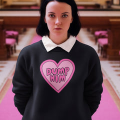 Image of a black dump him sweatshirt with a hand-illustrated heart and 'Dump Him' hand-lettered in bubble writing. This bold  feminist sweatshirt is a statement of independence and empowerment. Shop our feminist apparel today!