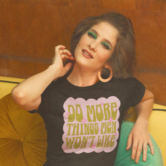 black feminist shirt that says do more things men won't like in lime green 70's writing. Shop feminist trash for feminist clothing, controversial shirts and dump him shirts.