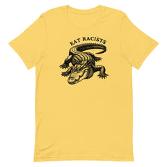 Yellow political shirt that says eat Racists in black writing featuring an illustration of an alligator- shop feminist trash for political clothes 