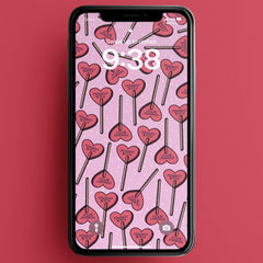 digital download of feminist phone wallpaper featuring a red heart lollipop pattern that says feminist bitch on a pink background. Shop feminist trash for cute phone wallpapers and feminist tshirts