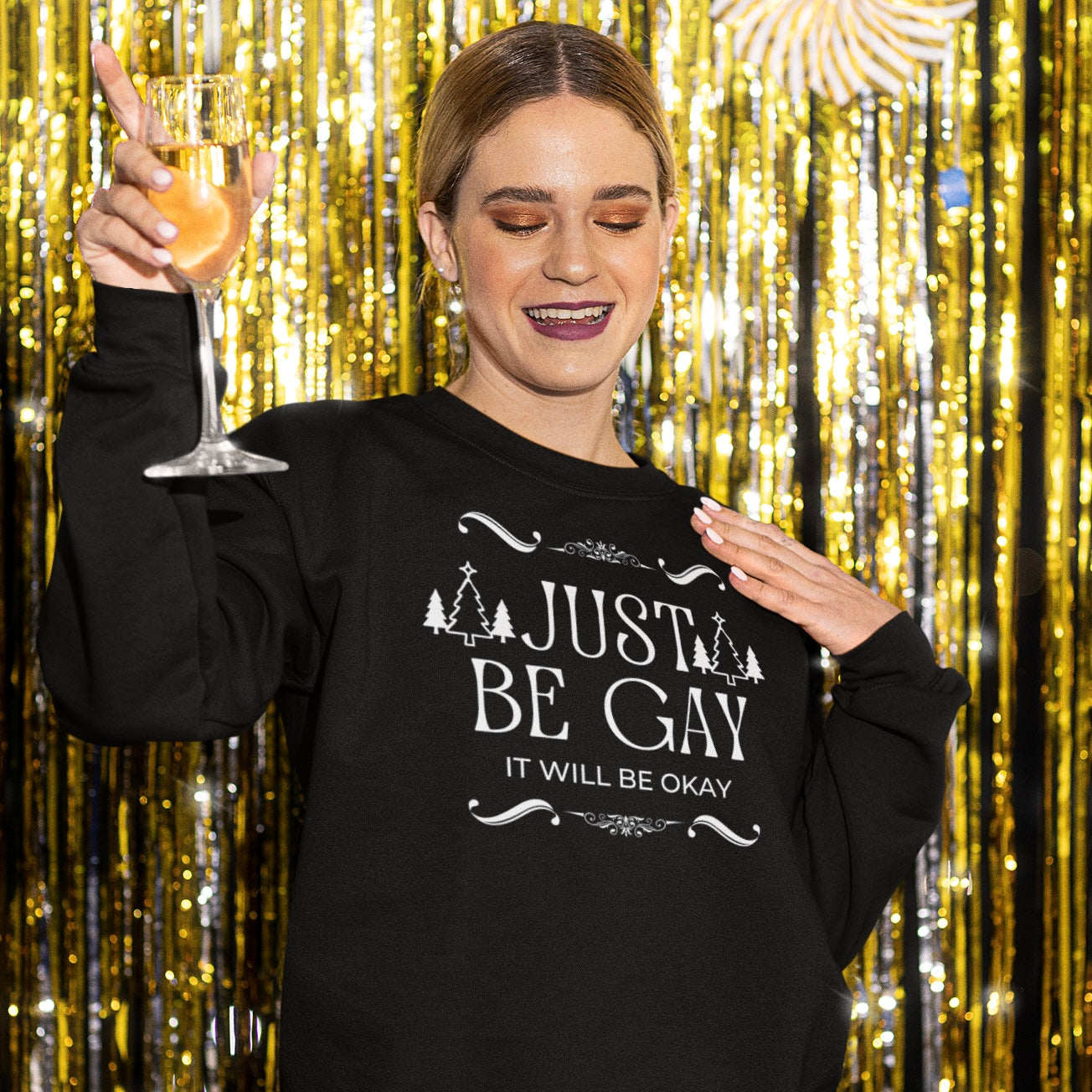 Pride themed Christmas sweatshirt that says just be gay, it will be okay! In white writing. Shop feminist trash for pride merch 