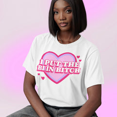 bisexual tshirt in white that says i put the bi in bitch in whit retro writing on top of a retro pink and purple heart graphic. Shop Feminist Trash Store for pride merch, bisexual pride merch, and outfits for pride.