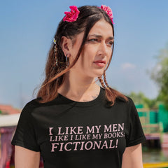 black feminist tee that says I like my men like I like by books; fictional! in pink writing- shop feminist trash for feminist clothing and book lover tees.