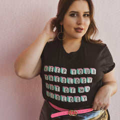 Black feminist t-shirt boldly declaring "Keep Your Theology Out of My Biology- Shop Feminist Trash for feminist tshirts, Pride merch and political clothes 