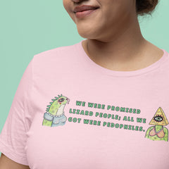Pink political shirt that says we were promised lizard people; all we got were pedophiles in green writing featuring two Illuminati illustrations. Shop feminist trash for political clothing and feminist apparel 