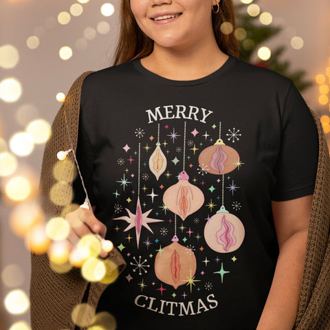 Black Christmas tshirt that says merry clitmas, featuring Christmas decorations with vagina drawings. Shop feminist trash for feminist Christmas t-shirts and feminist clothing.