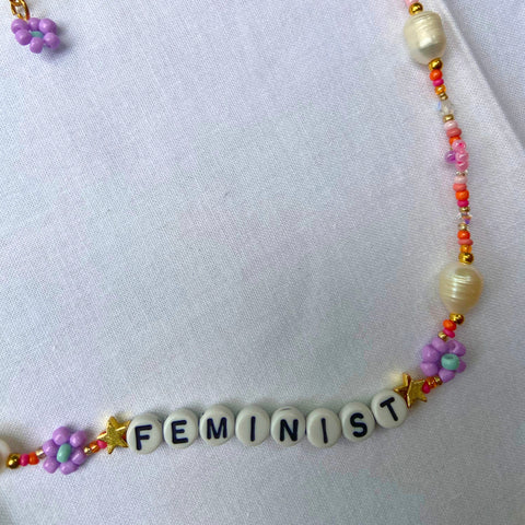 orange seed bead feminist necklace featuring fresh water pearls and crystals. Shop feminist jewellery for empowered women