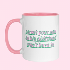 White feminist mug with the phrase "Parent your son so his girlfriend won't have to" in pink writing, accented with green details- Shop ceramic mugs for the empowered woman