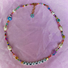 Rainbow Beaded Feminist Necklace with Seed Beads, Crystals, and Freshwater Pearls