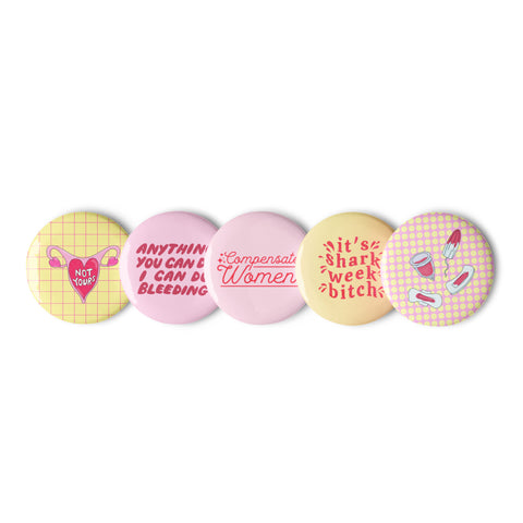 Set of five period positive feminist pins, including slogans "Anything you can do I can do bleeding," "Not yours" with uterus image, "It's shark week, bitch," illustration of used period products, and "Compensate women" in red flowing text- Shop Feminist Badges For Empowered Women