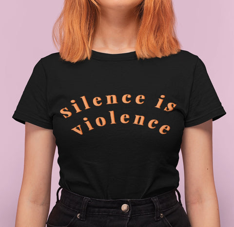 Black feminist graphic tee that says silence is violence in bold orange lowercase writing - Shop feminist attire