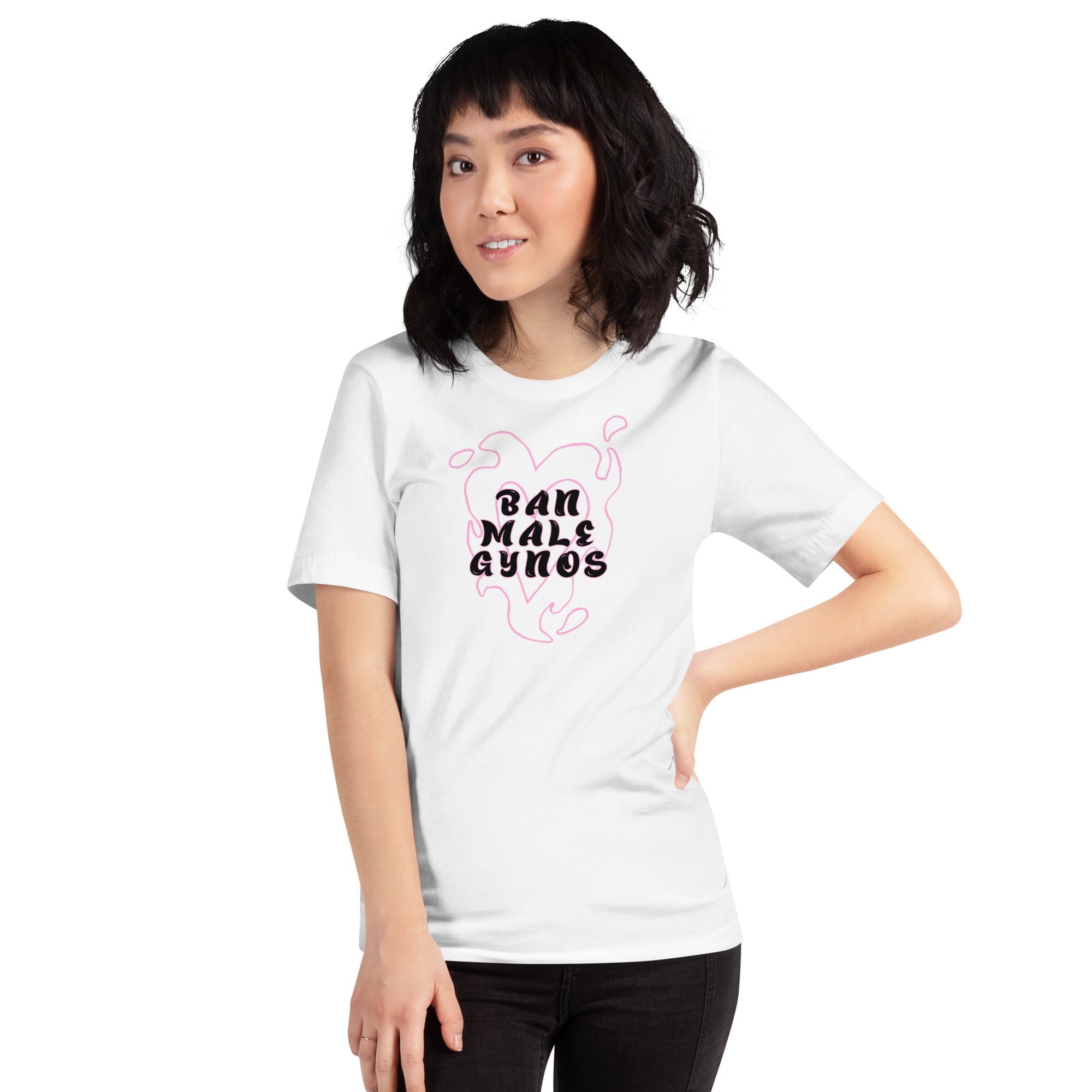 A woman with a short dark bob haircut poses with one hand on her hip against a white background, modeling a white fitted graphic tee that reads Ban Male Gynos inside a pink flame heart, an independent political clothing design by Feminist Trash.
