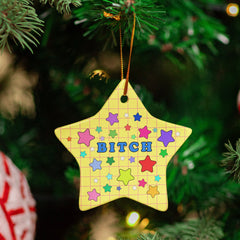 yellow star ceramic christmas ornament that says bitch surrounded by stars- shop feminist trash for feminist merch and christmas decorations