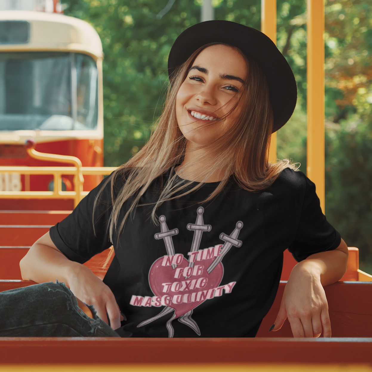 Black feminist t-shirt with 'No Time for Toxic Masculinity' text and Three of Swords tarot imagery, advocating against harmful gender stereotypes. Shop feminist apparel