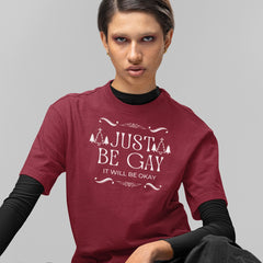 Pride themed Christmas t-shirt that says just be gay, it will be okay! In white writing. Shop feminist trash for pride merch 