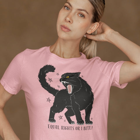 pink feminist halloween shirt that says equal rights or i bite in black writing- featuring an angry black cat illustration. Shop feminist trash for witchy outfits and feminist t shirts