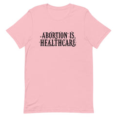 Pink feminist shirt advocating 'Abortion is Healthcare