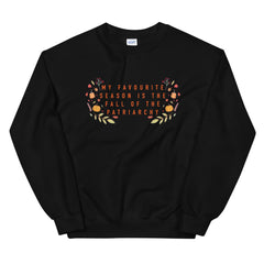 Feminist sweatshirt in black with the text 'My Favorite Season is the Fall of the Patriarchy,' symbolizing empowerment and advocating for gender equality.