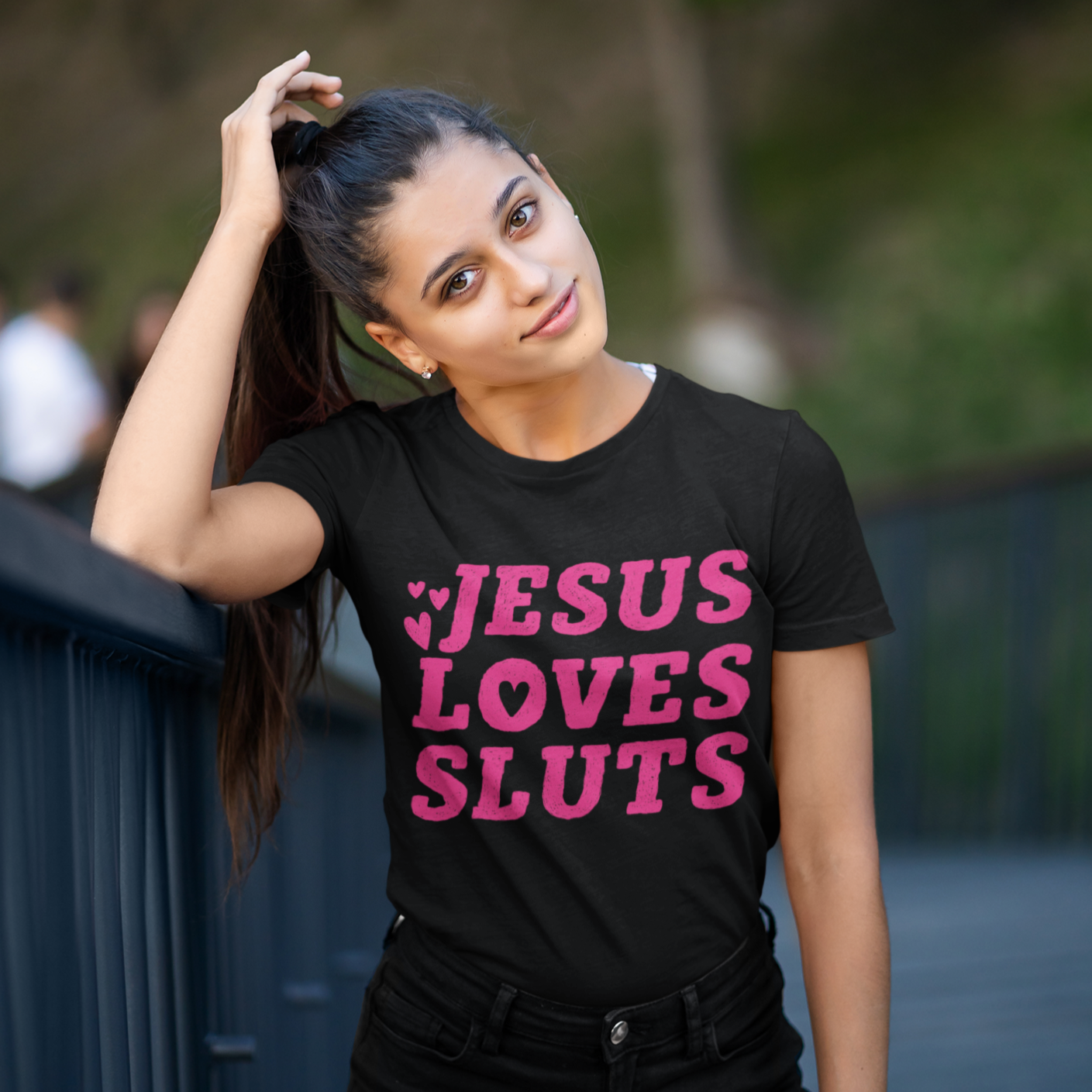 Women's rights t-shirt in black asserting 'Jesus Loves Sluts