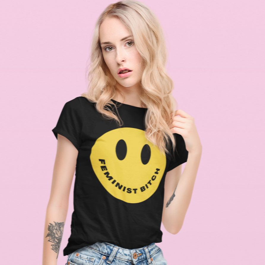 Black feminist t-shirt boldly stating "Feminist Bitch" with a yellow smiley face