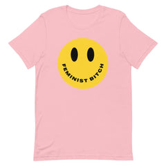 Pink feminist t shirt boldly stating "Feminist Bitch" with a yellow smiley face