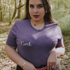 Purple triblend feminist t shirt boldly featuring "Cunt" in white writing