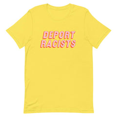 Yellow feminist t shirt conveying: "Deport Racists" in peach writing