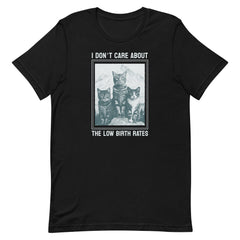 A solid black crewneck t-shirt with a vintage-style illustration of three cats and the quote "I DON'T CARE ABOUT THE LOW BIRTH RATES." High-contrast social justice apparel.