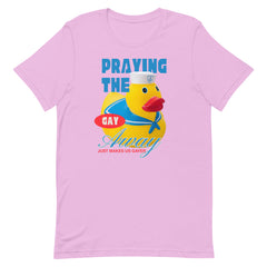 A lilac alternative pride t shirt displayed on a white background showing a vintage style yellow rubber ducky graphic with blue text that reads praying the gay away just makes us gayer