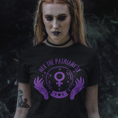 black feminist t-shirt that says hex the patriarchy in purple writing- featuring a crystal ball with the female symbol inside. shop feminist trash for witchy outfits and feminist t shirts