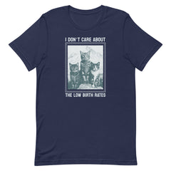 Navy blue graphic t-shirt showing three cats in a framed vintage illustration with the text "I DON'T CARE ABOUT THE LOW BIRTH RATES." Edgy feminist fashion.