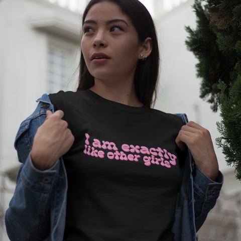 black feminist tshirt that says I Am Exactly Like Other Girls in pink wavy writing- shop feminist trash for feminist tees and dump him tshirts