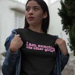 black feminist tshirt that says I Am Exactly Like Other Girls in pink wavy writing- shop feminist trash for feminist tees and dump him tshirts