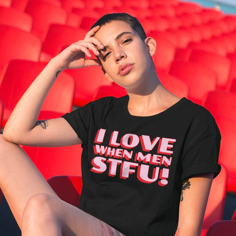 black feminist shirt that says i love when men stfu! in pink and red bold writing- shop feminist trash for funny feminist t-shirts