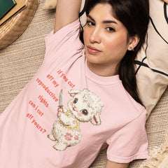 pink pro choice tshirt that says if you cut off my reproductive rights can i cut off yours in an orange red writing- featuring a lamb holding a knife illustration. Shop feminist trash for feminist clothing and political shirts