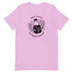 lilac feminist shirt that says aqua tofana the original solution in black art nouveau sstyle writing. Featuring a black tattoo style illustration of a poison bottle- Shop feminist trash for feminist tees and dump im shirts.