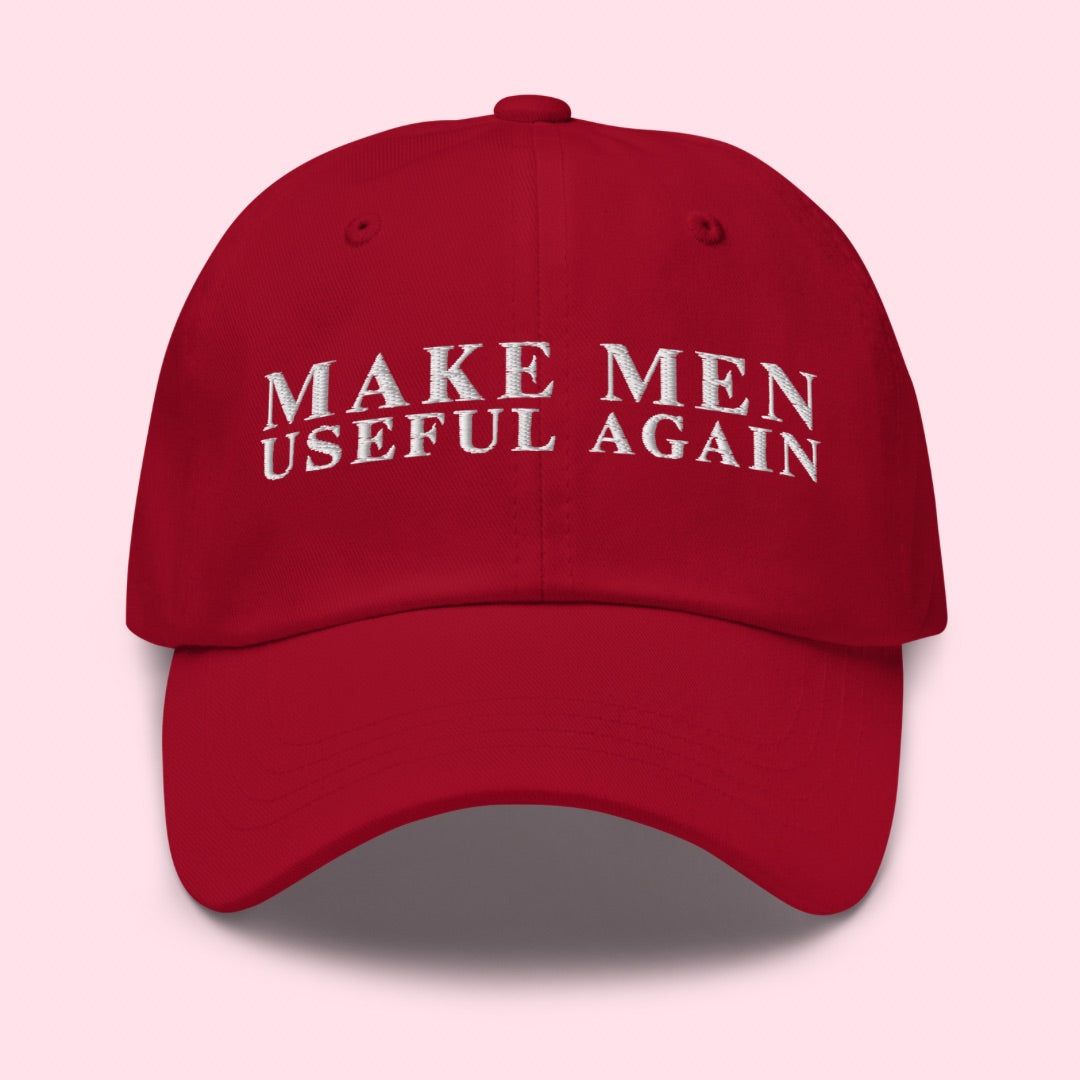 red political hat that says make men useful again in white embroidery- shop feminist trash for feminist hats and political clothing